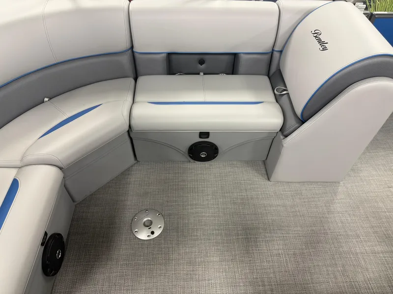 Slide: The Image of 2025 Bentley Pontoons Legacy 240 Cruise interior with gray and blue seating. - 16