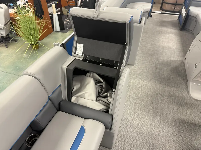 Slide: The Image of 2025 Bentley Pontoons Legacy 240 Cruise interior with open storage compartment. - 17