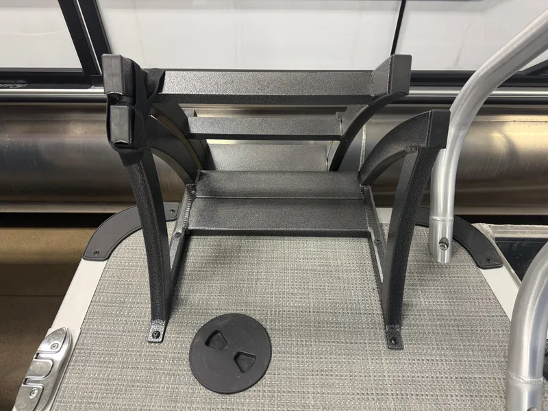 Slide: The Image of 2025 Bentley Pontoons Legacy 240 Cruise deck with folded ladder and textured flooring. - 19