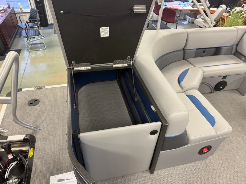 Slide: The Image of 2025 Bentley Pontoons Legacy 240 Cruise interior with open storage compartment. - 21