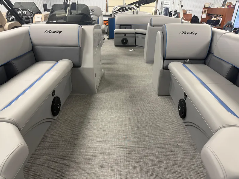 Slide: The Image of 2025 Bentley Pontoons Legacy 240 Cruise interior with gray seating and modern design. - 7