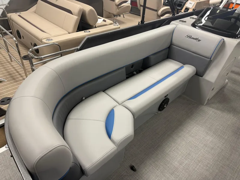 Slide: The Image of 2025 Bentley Pontoons Legacy 240 Cruise interior with gray and blue seating. - 8