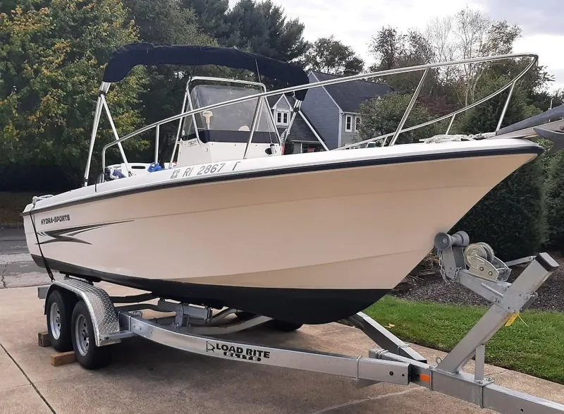 Slide: The Image of 2004 Hydra-Sports Lightning 212 CC boat on trailer, parked in driveway. - 1