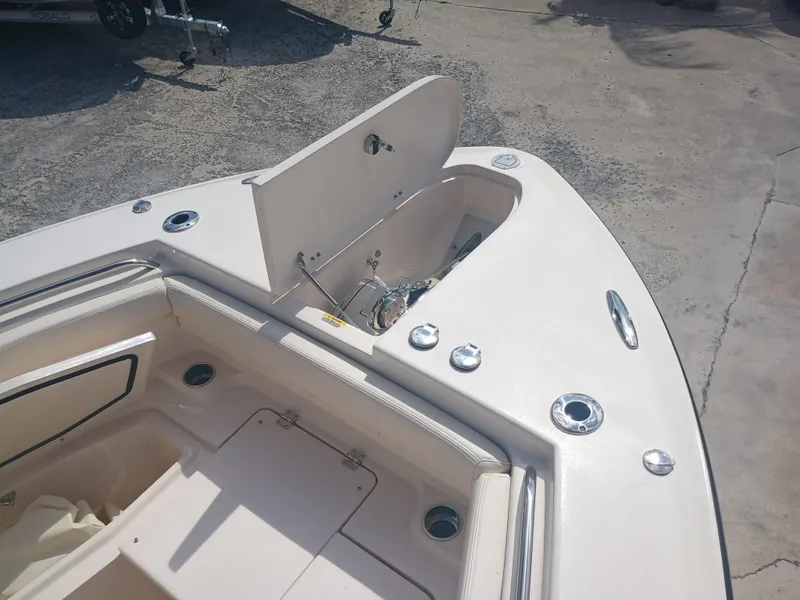Slide: The Image of 2025 Grady-White Canyon 306 boat deck with open storage compartment. - 16