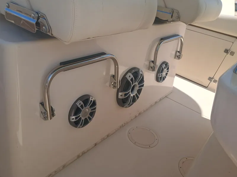 Slide: The Image of 2025 Grady-White Canyon 306 boat interior with speakers and stainless steel handles. - 22
