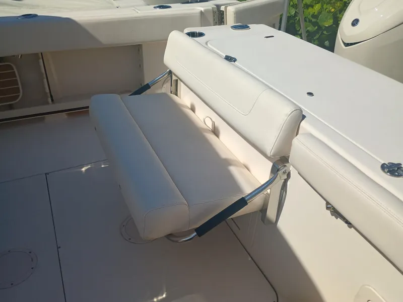 Slide: The Image of 2025 Grady-White Canyon 306 boat seat, white upholstery, sleek design. - 24