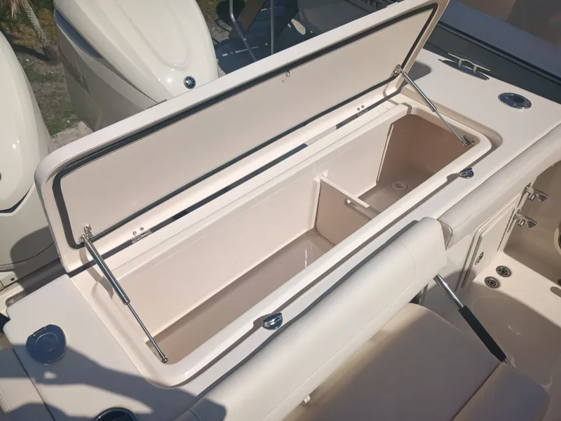 Slide: The Image of Open storage compartment on 2025 Grady-White Canyon 306 boat, showcasing interior space. - 29