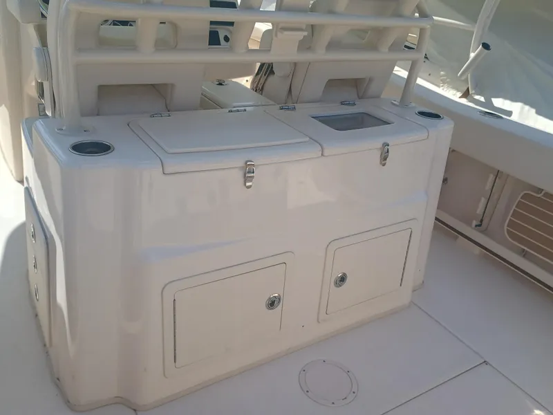 Slide: The Image of 2025 Grady-White Canyon 306 boat interior with storage compartments and cup holders. - 30