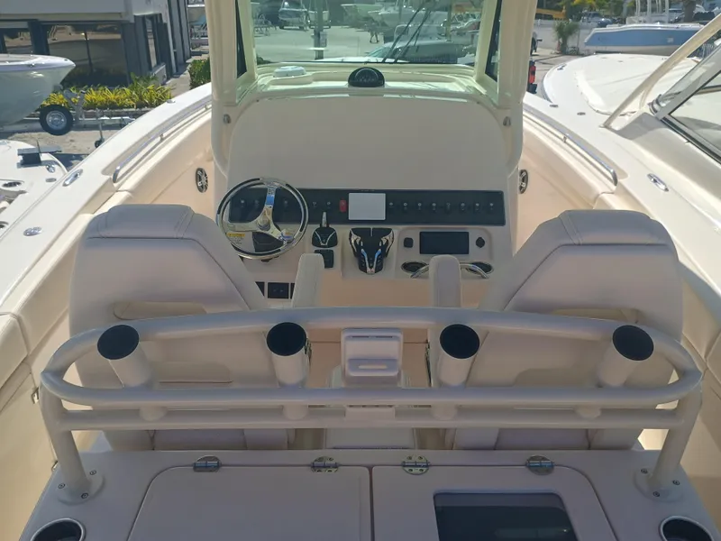Slide: The Image of 2025 Grady-White Canyon 306 boat interior with steering wheel and control panel. - 31