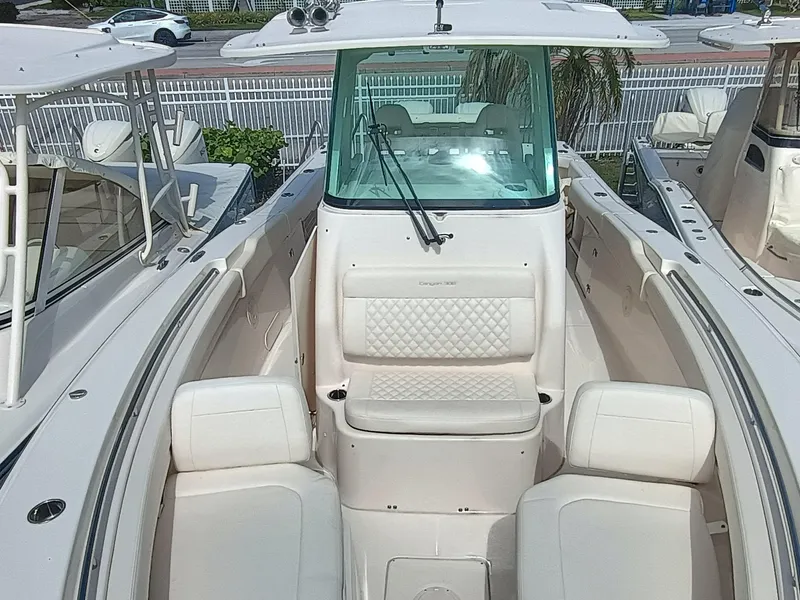 Slide: The Image of 2025 Grady-White Canyon 306 boat interior with white seating and windshield. - 5