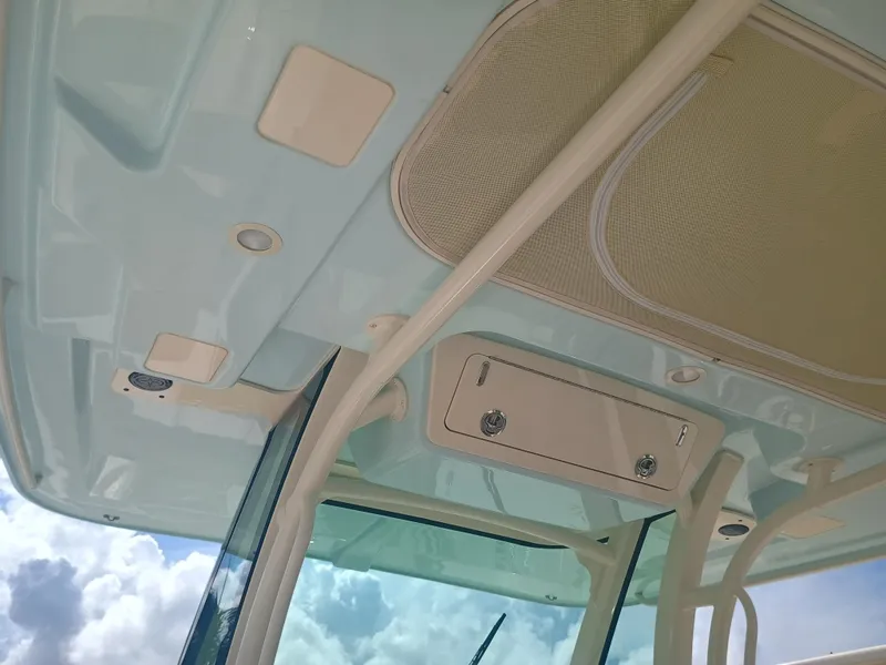 Slide: The Image of 2025 Grady-White Canyon 306 boat interior ceiling with storage compartments. - 7