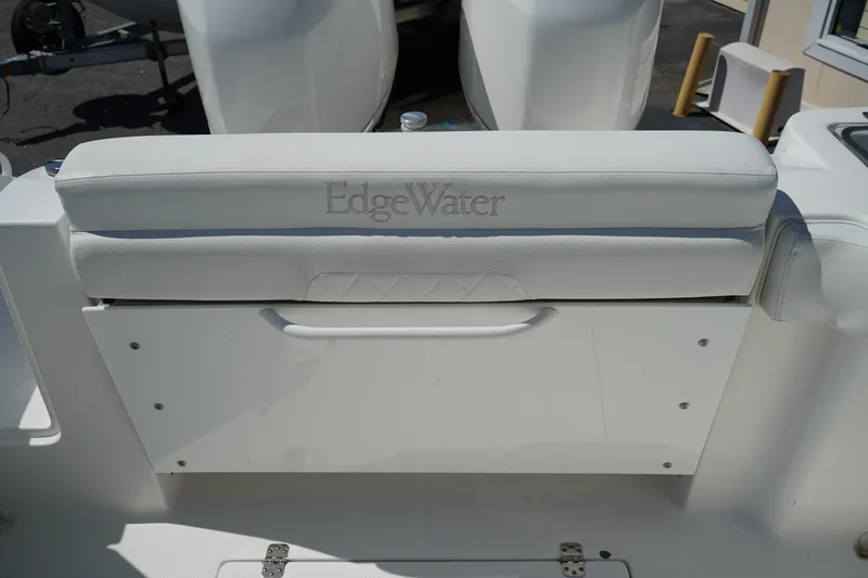 Slide: The Image of 2018 Edgewater 262 CX boat seat with embossed logo, white upholstery. - 11
