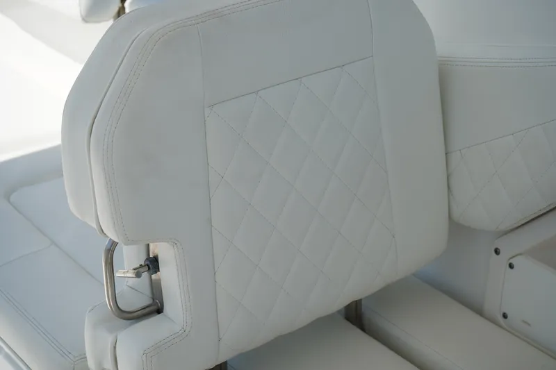 Slide: The Image of White leather seat with diamond stitching in 2018 Edgewater 262 CX boat. - 26