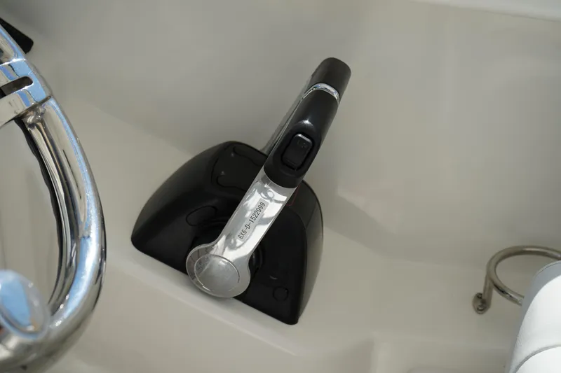 Slide: The Image of Throttle control of 2018 Edgewater 262 CX boat, featuring sleek design and ergonomic handle. - 38