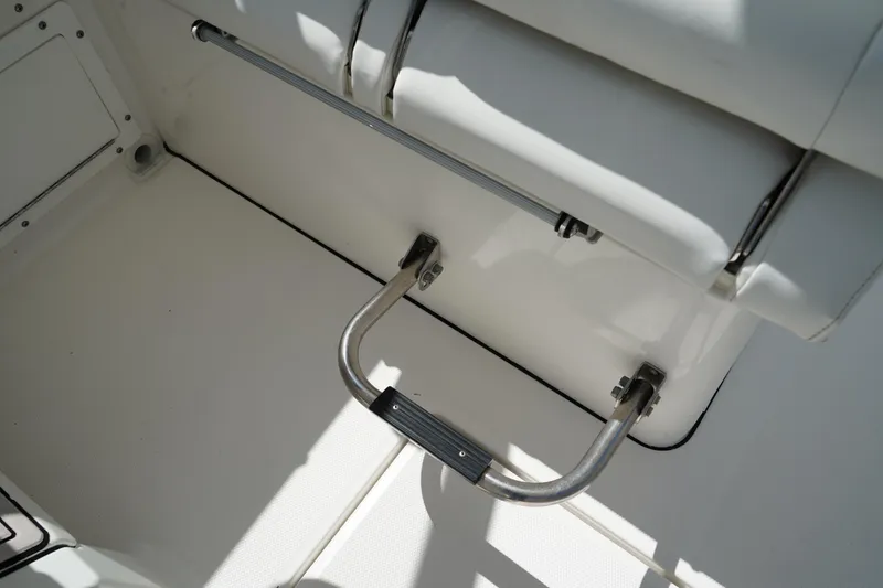 Slide: The Image of Stainless steel footrest on 2018 Edgewater 262 CX boat interior. - 39