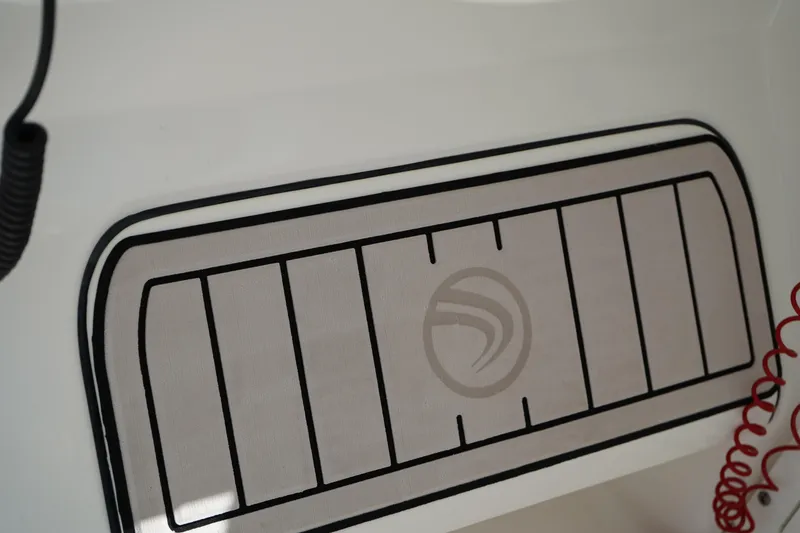 Slide: The Image of Edgewater 262 CX 2018 boat deck with logo and red coiled cable. - 40
