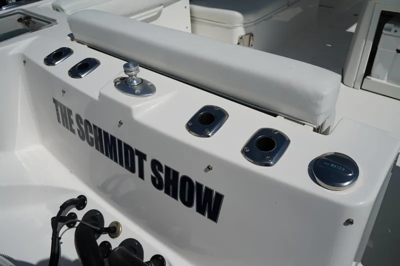 Slide: The Image of 2018 Edgewater 262 CX boat interior with "The Schmidt Show" text on white surface. - 9