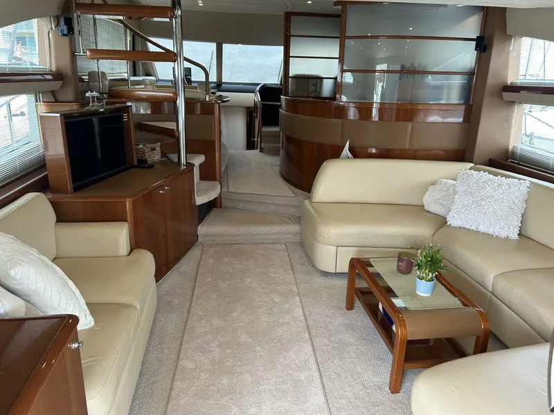 Slide: The Image of Luxurious interior of a 2008 Princess 67 Flybridge yacht with elegant seating and modern decor. - 16