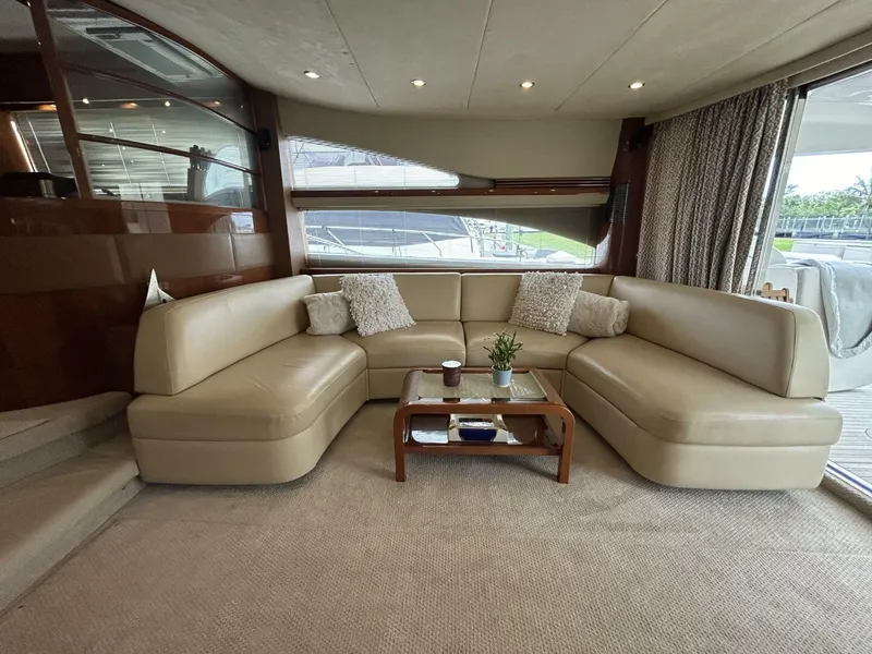 Slide: The Image of Luxurious interior of 2008 Princess 67 Flybridge yacht with beige leather seating and elegant decor. - 17