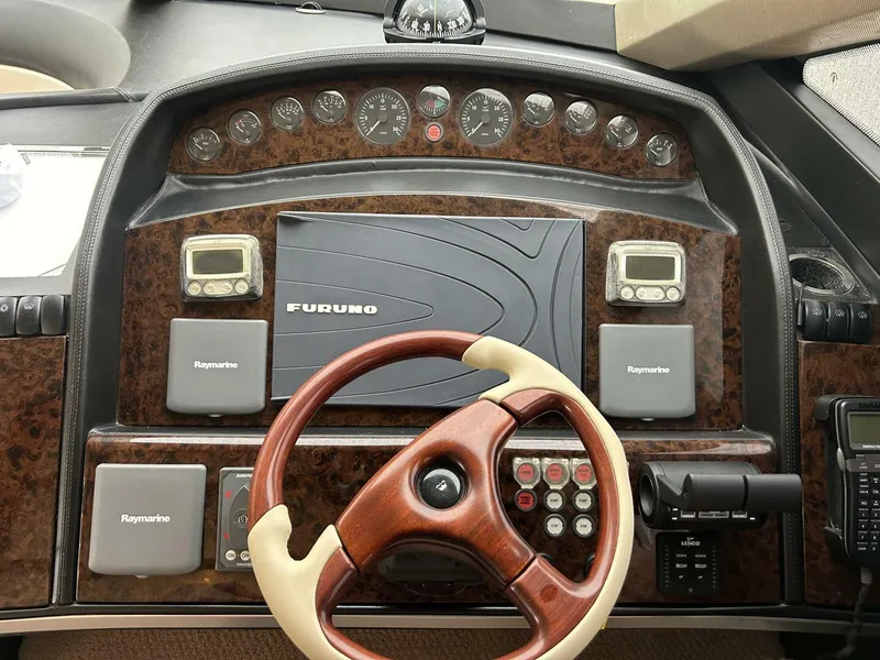 Slide: The Image of Helm of 2008 Princess 67 Flybridge yacht with Furuno navigation system and Raymarine controls. - 24