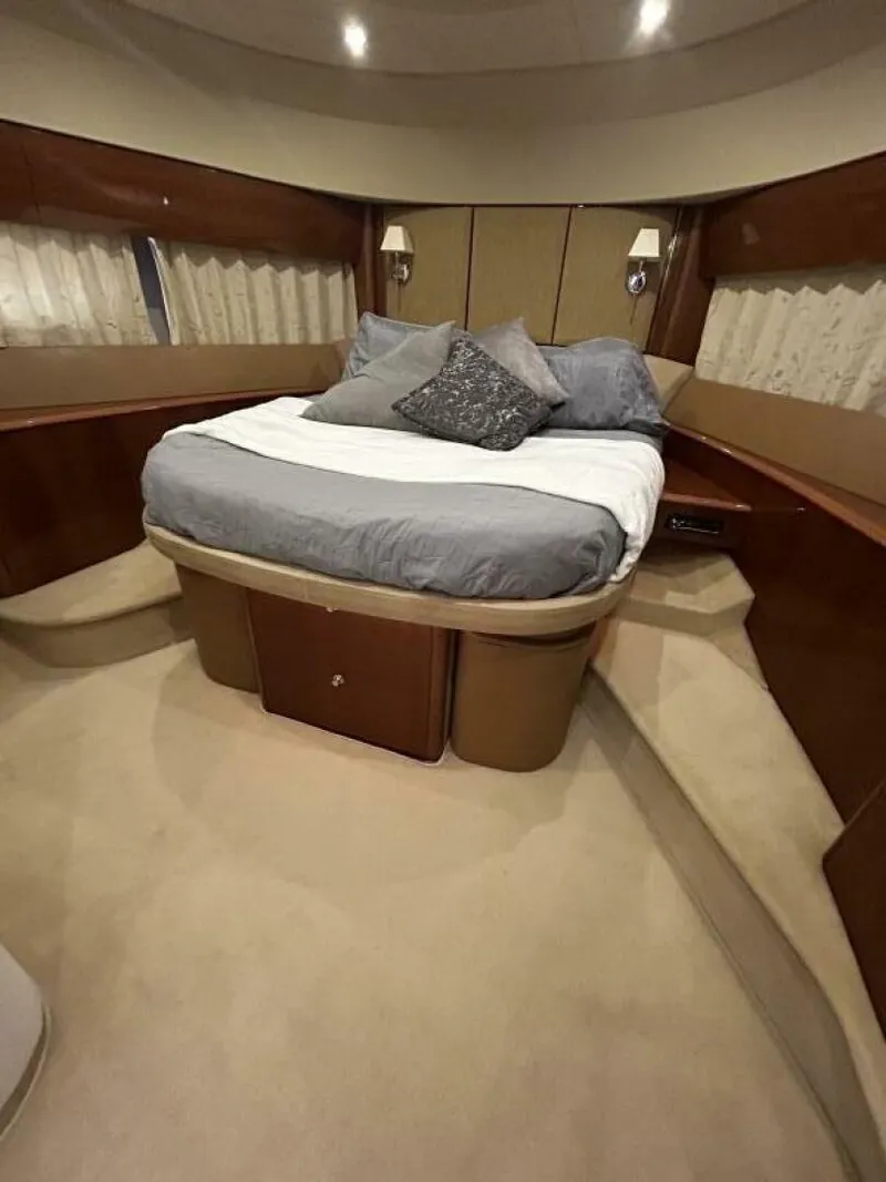Slide: The Image of Luxurious bedroom interior of 2008 Princess 67 Flybridge yacht with elegant bedding. - 29