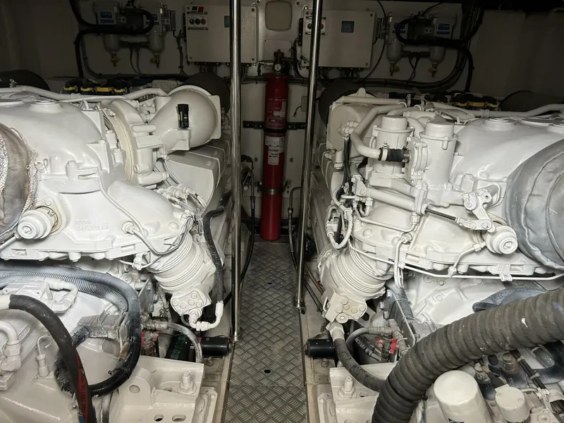 Slide: The Image of Engine room of a 2008 Princess 67 Flybridge yacht, featuring dual engines and equipment. - 34