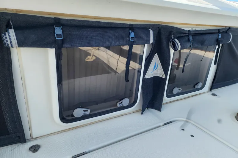 Slide: The Image of Lagoon 400 catamaran windows with protective covers, 2012 model. - 10