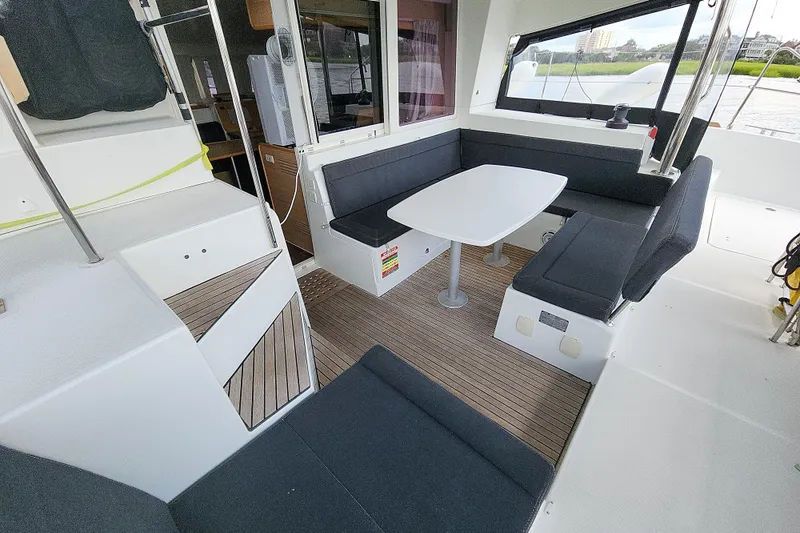 Slide: The Image of Interior of 2012 Lagoon 400 catamaran with seating area and table. - 21
