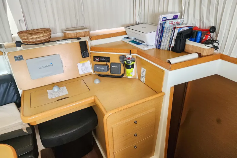 Slide: The Image of Navigation station in a 2012 Lagoon 400 catamaran with Garmin and Raymarine equipment. - 31