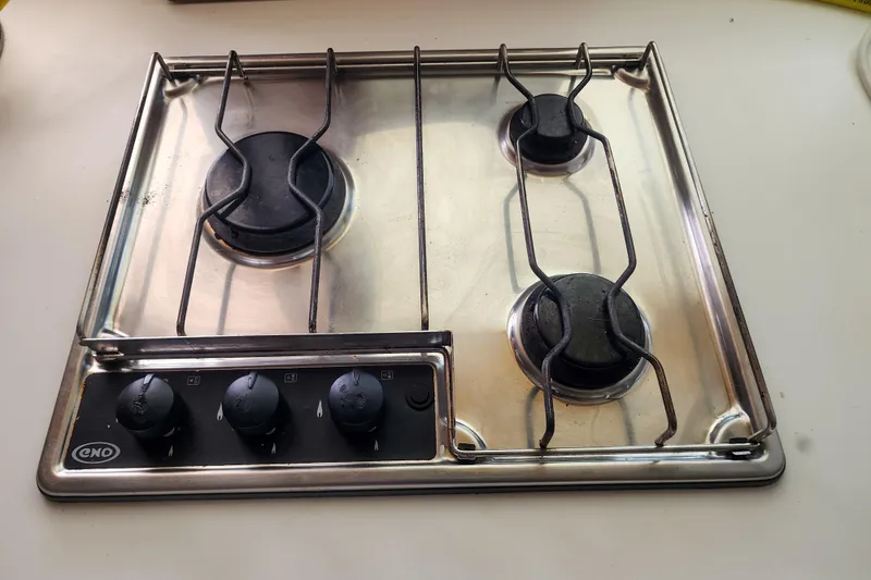 Slide: The Image of Three-burner stainless steel stove on Lagoon 400, 2012 model yacht kitchen. - 34