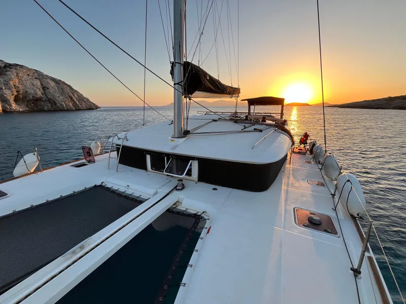 Slide: The Image of Lagoon 400 catamaran sailing at sunset, 2012 model, with scenic ocean view. - 4