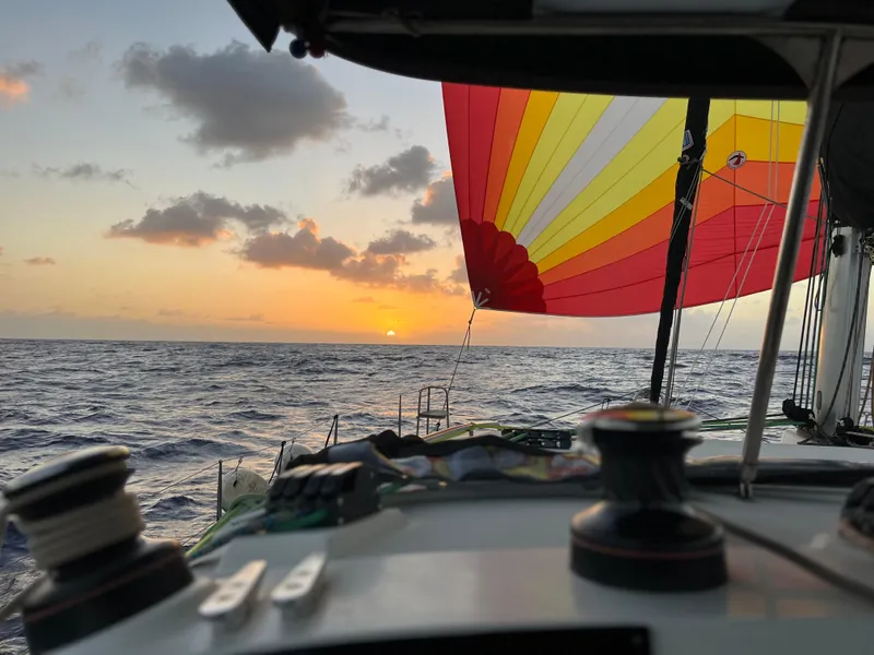 Slide: The Image of Sailing Lagoon 400 at sunset with colorful spinnaker, 2012 model. - 52
