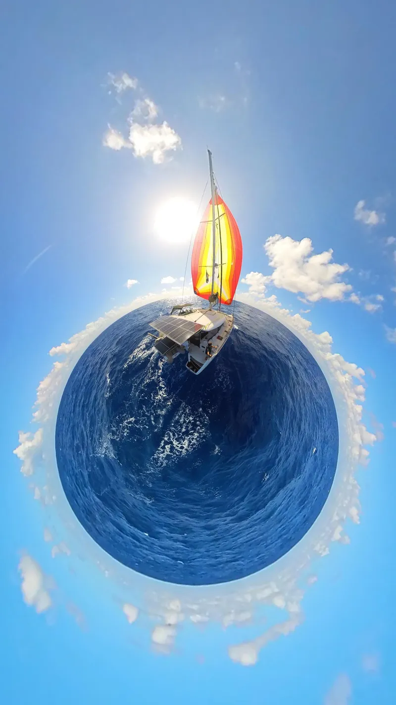 Slide: The Image of Aerial view of Lagoon 400 catamaran sailing under a vibrant sky, 2012 model. - 54