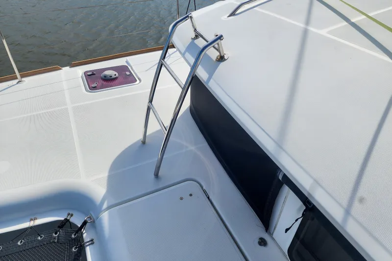 Slide: The Image of Deck view of 2012 Lagoon 400 catamaran with ladder and hatch. - 9