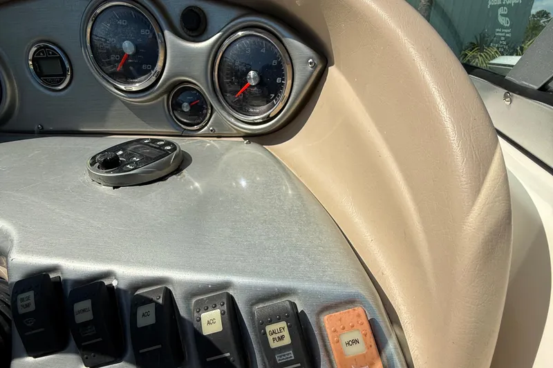 Slide: The Image of 2012 Hurricane SunDeck 217 OB dashboard with gauges and control switches. - 14