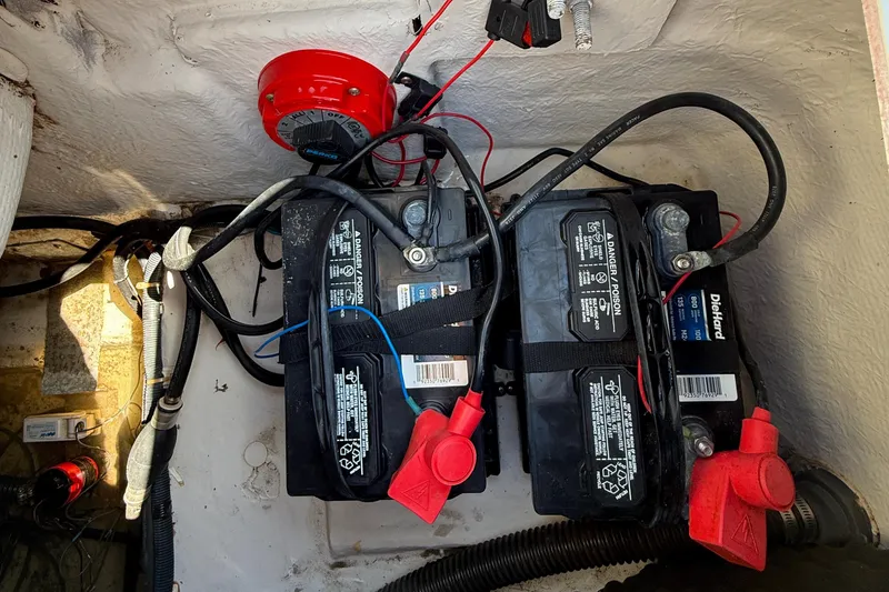Slide: The Image of Two marine batteries in a 2012 Hurricane SunDeck 217 OB boat compartment. - 15