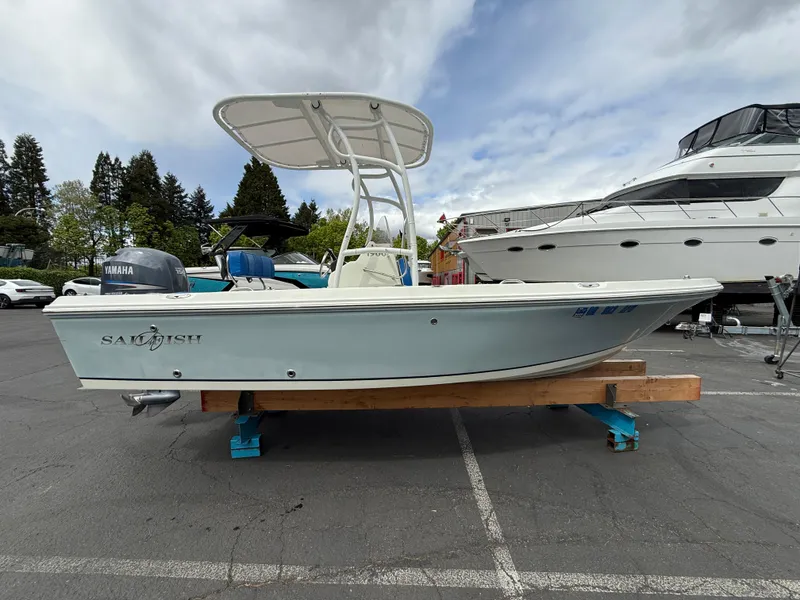 Slide: The Image of 2008 Sailfish 1900 BB Bay Boat on display in a parking lot. - 1