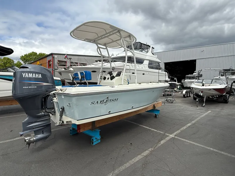 Slide: The Image of 2008 Sailfish 1900 BB Bay Boat with Yamaha motor in a marina setting. - 3