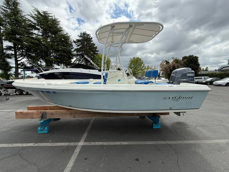 Slide: The Image of 2008 Sailfish 1900 BB Bay Boat on display in a parking lot. - 5