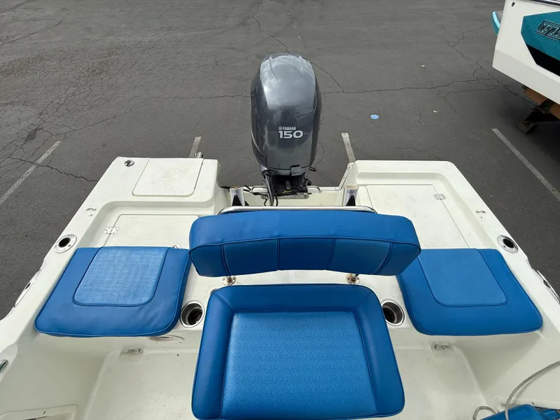 Slide: The Image of 2008 Sailfish 1900 BB Bay Boat with blue seating and Yamaha 150 outboard motor. - 8
