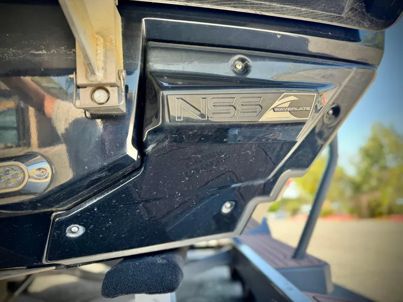 Slide: The Image of 2016 Nautique Super Air G23 NSS waveplate detail on boat exterior. - 11