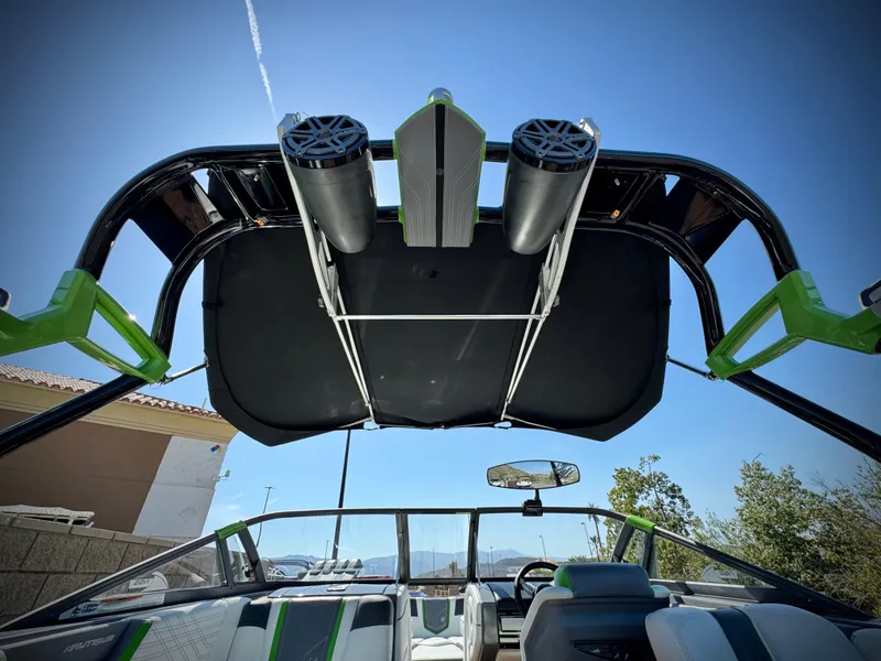 Slide: The Image of 2016 Nautique Super Air G23 boat with speakers and canopy, viewed from interior. - 12
