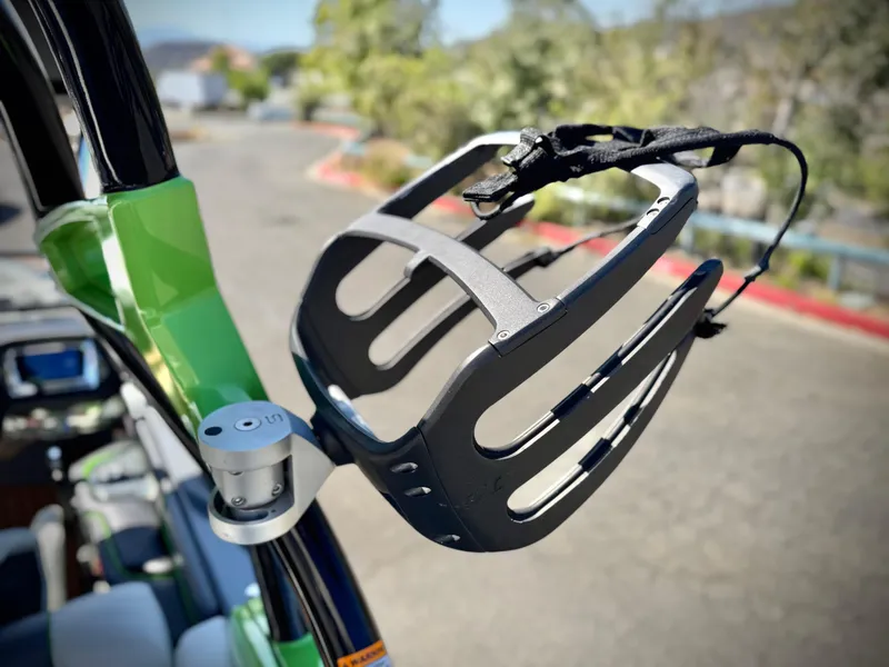 Slide: The Image of 2016 Nautique Super Air G23 wakeboard rack, close-up view, with green and black accents. - 14