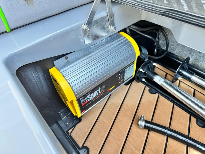 Slide: The Image of Battery charger in 2016 Nautique Super Air G23 boat compartment. - 26