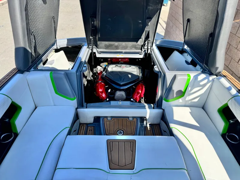 Slide: The Image of 2016 Nautique Super Air G23 boat interior with open engine compartment. - 29