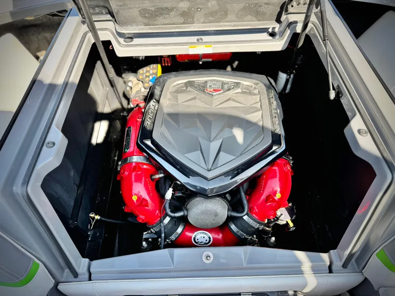 Slide: The Image of Engine compartment of a 2016 Nautique Super Air G23 boat, featuring a powerful engine. - 30