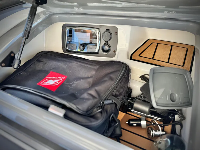 Slide: The Image of Storage compartment of 2016 Nautique Super Air G23 with equipment and accessories. - 33