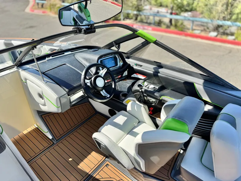 Slide: The Image of 2016 Nautique Super Air G23 boat interior with modern dashboard and seating. - 36