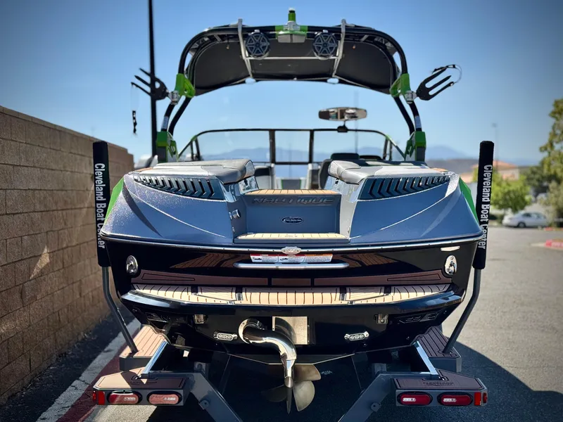 Slide: The Image of 2016 Nautique Super Air G23 boat on trailer, rear view, parked outdoors. - 4