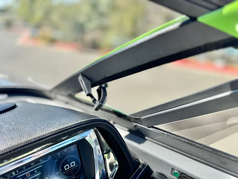 Slide: The Image of 2016 Nautique Super Air G23 dashboard with digital display and windshield detail. - 43